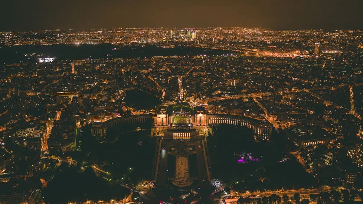 Stunning aerial view of Paris city lights at night, showcasing urban elegance.