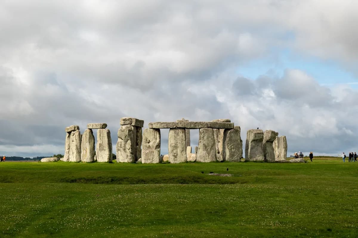 A stunning view of Stonehenge against a backdrop of dramatic clouds.