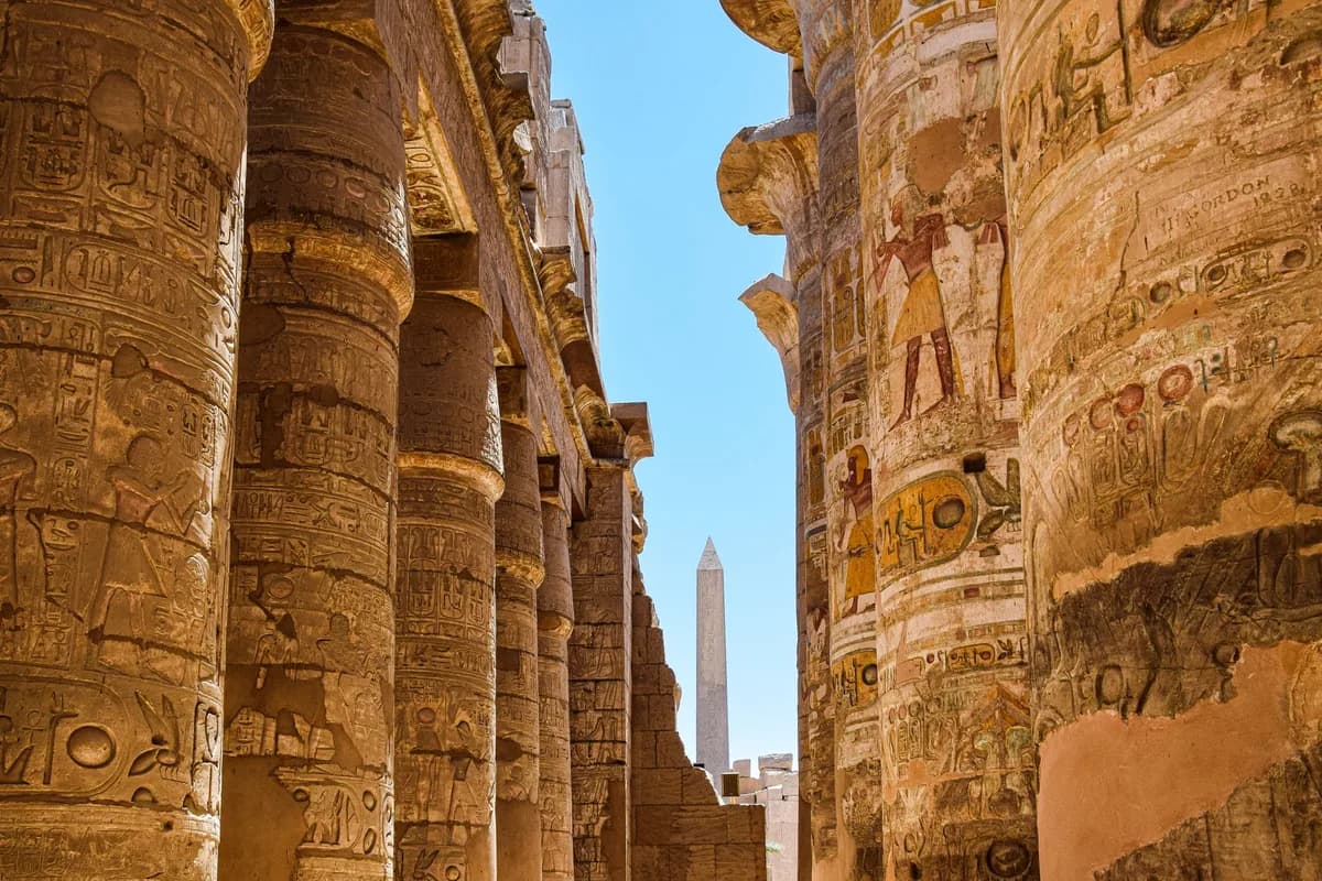Explore the majestic columns and hieroglyphs at Karnak Temple in Egypt.