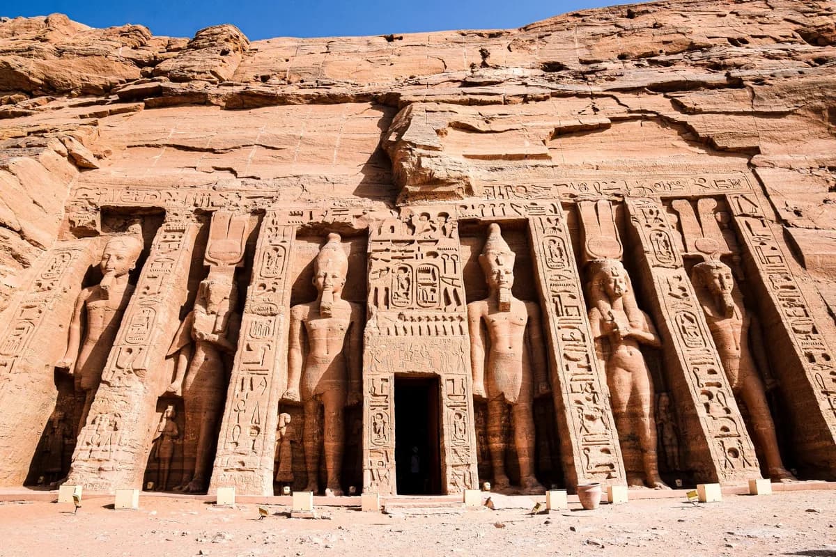 Explore the magnificent carvings at the entrance of the ancient Egyptian temple in Abu Simbel.