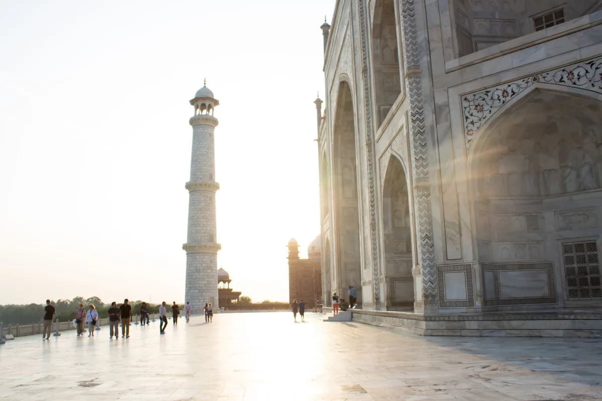 Beautiful sunrise at the iconic Taj Mahal with its majestic minaret in Agra, India.