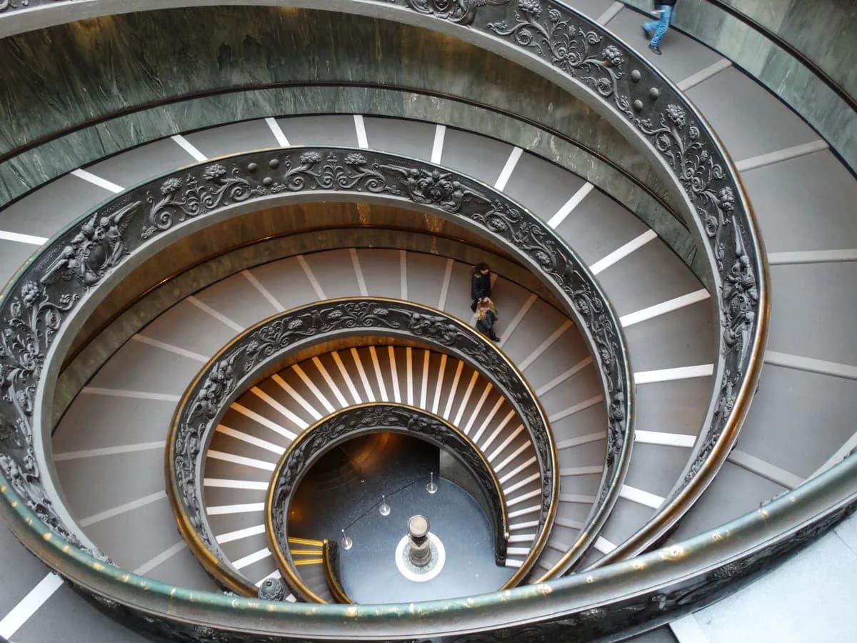 Elegant spiral staircase inside Vatican Museums, a renowned architectural marvel.