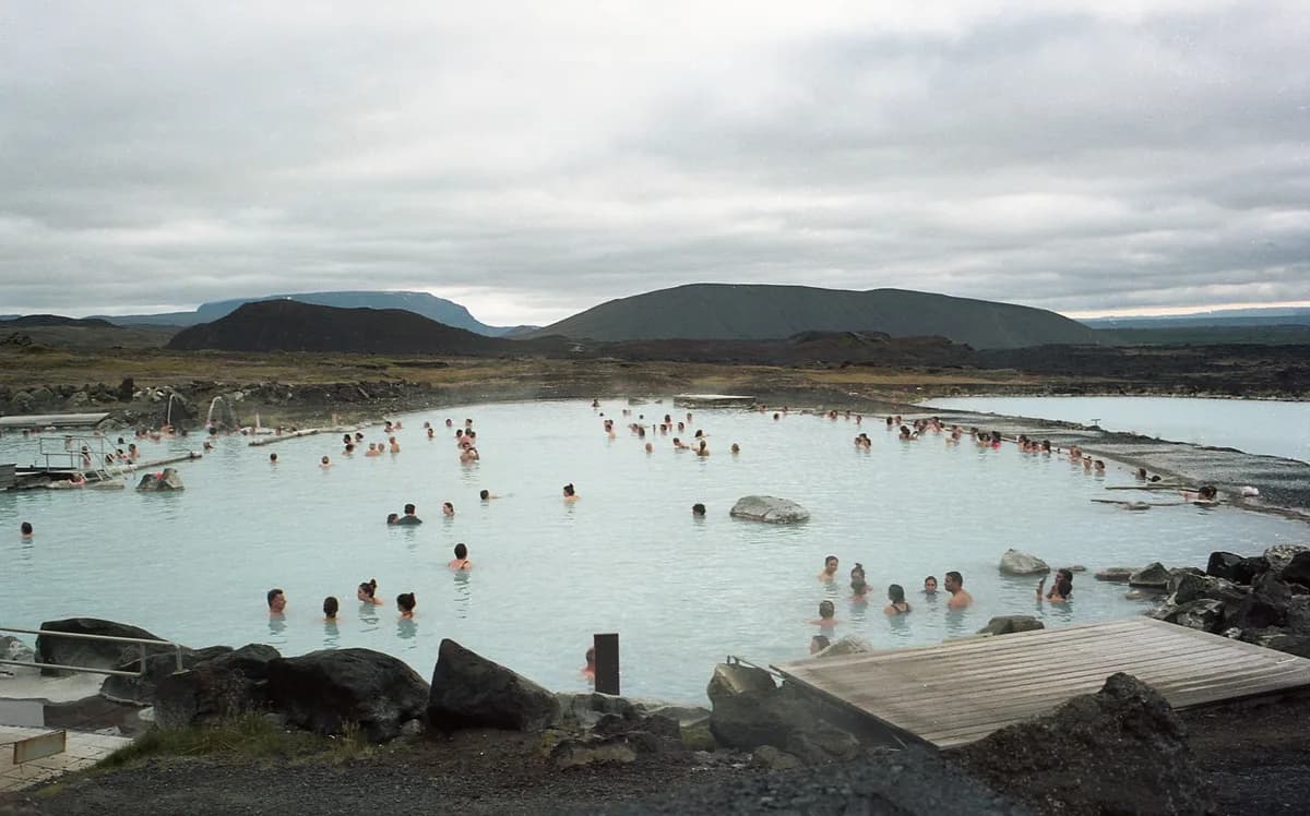 People enjoying relaxation in a natural geothermal spa in Reykjavík, Iceland.