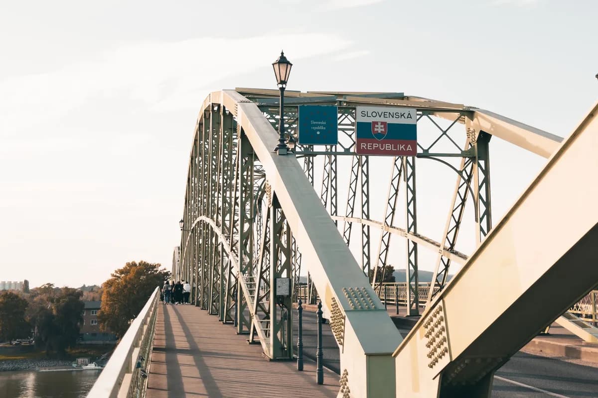A scenic view of Maria Valeria Bridge connecting Hungary and Slovakia over the Danube River.