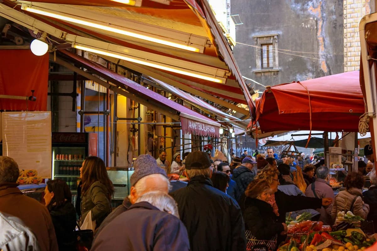 Experience the bustling street market in Catania, Sicily, full of local flavor and culture.