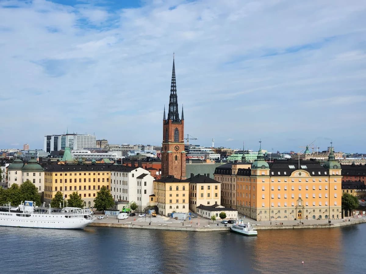 A stunning view of Riddarholmen Church and colorful buildings in Stockholm, Sweden.