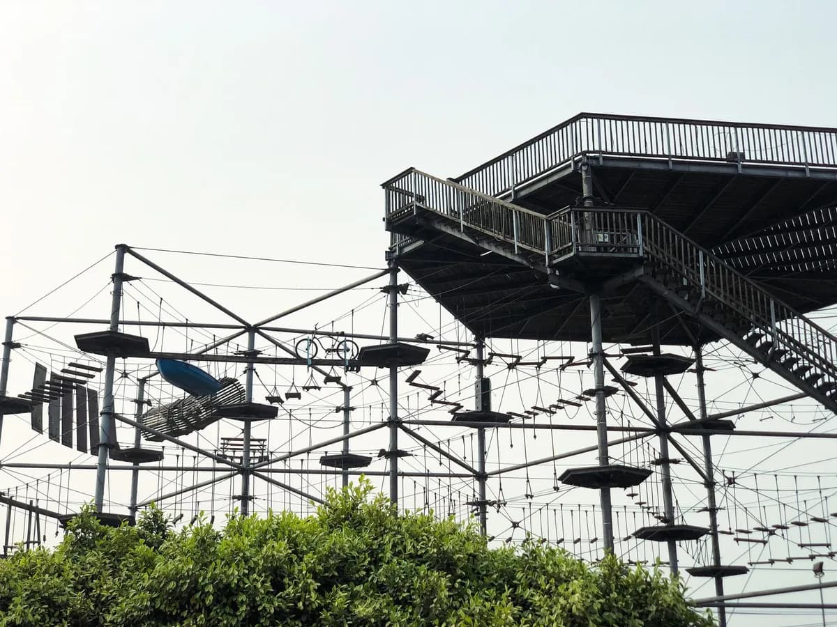 Explore the thrilling high rope adventure course in Port Harcourt, Nigeria, captured on a bright day.