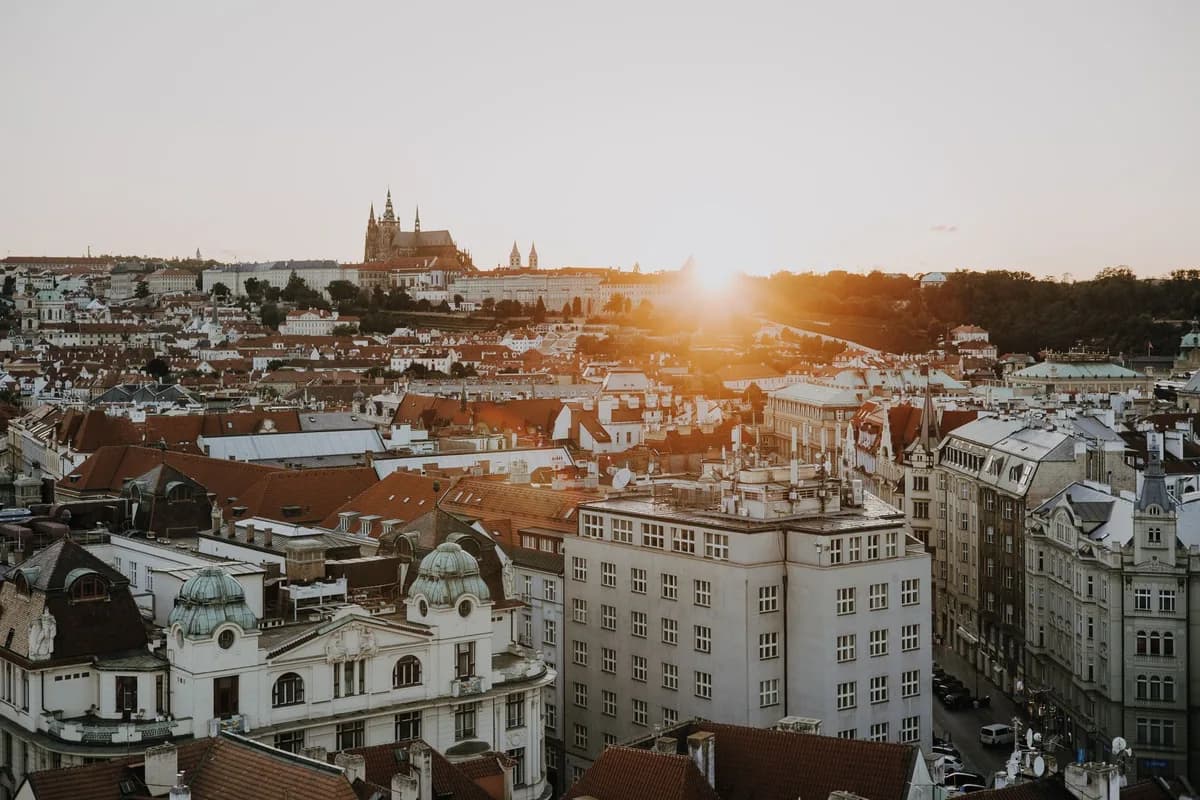 Stunning view of Prague at sunset, highlighting the historic skyline and architectural beauty.