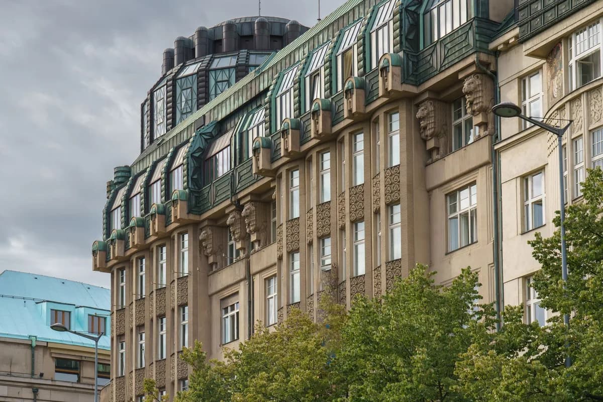 Detailed view of a historic Art Nouveau building facade in Prague, Czechia.