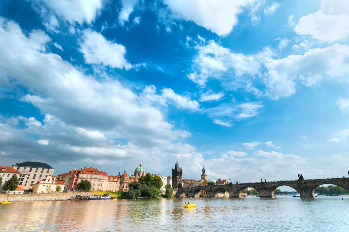 Picturesque clouds over Charles Bridge with vibrant cityscape in Prague.