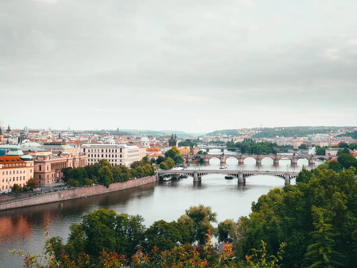 A stunning aerial view of Prague highlighting the city's bridges and historical architecture.