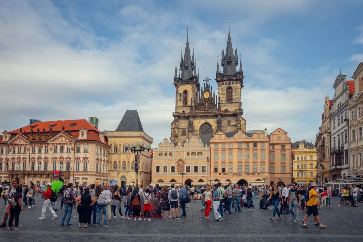 Crowds gather in Prague's Old Town Square, with the Church of Our Lady Before Týn.